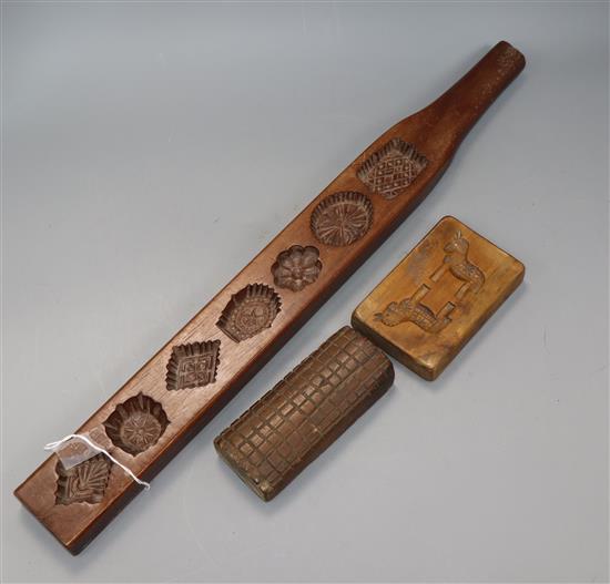 Three 19th century treen biscuit moulds